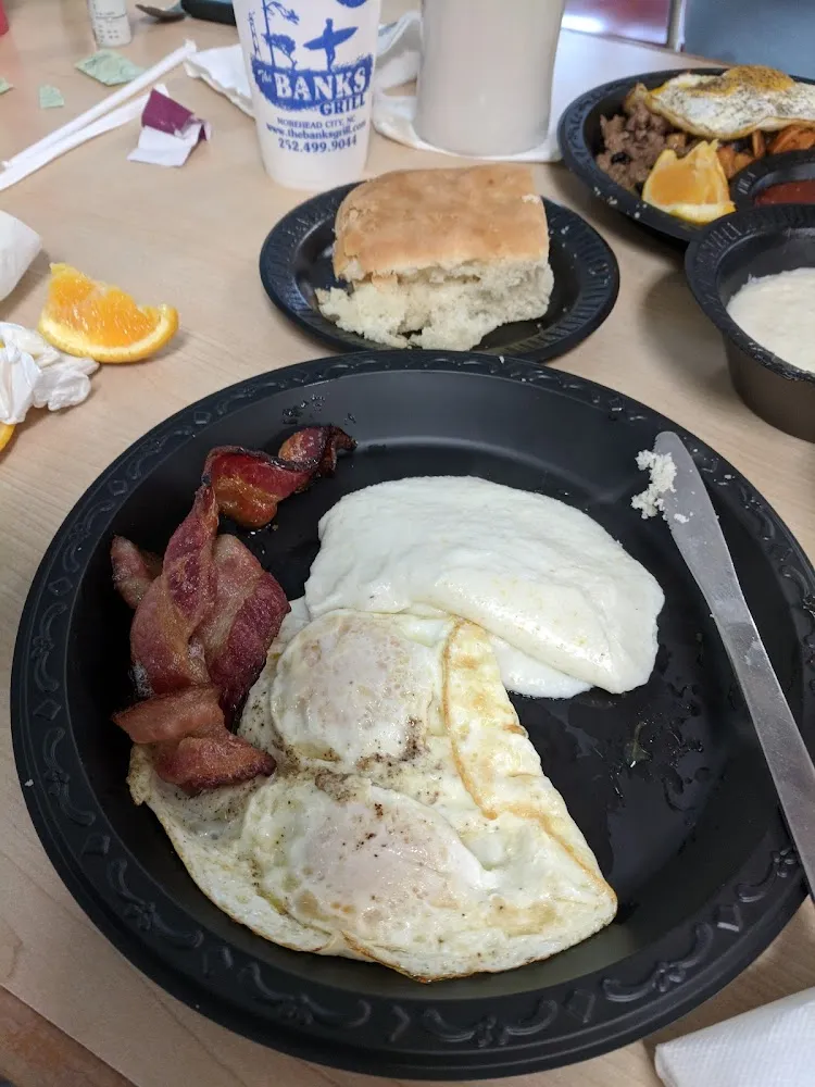 Two Eggs over Easy with Grits and Soft Bacon